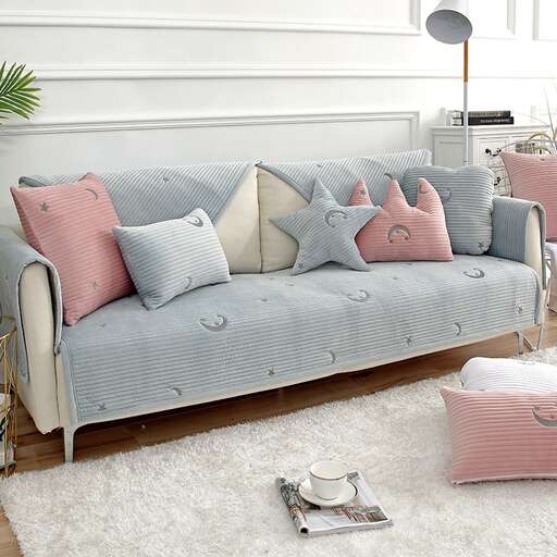 a sofa with a cushion and pillows