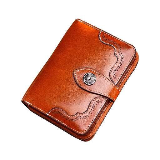 a leather wallet with a small button on the side.