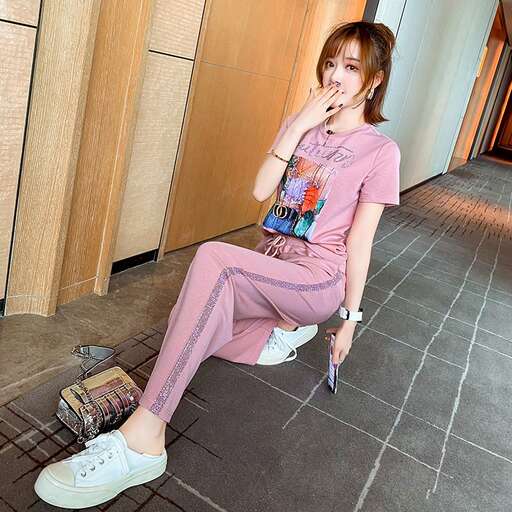 a woman sitting on the ground in a room.