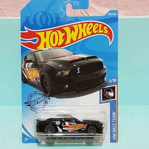 a toy car is on display next to a toy car.