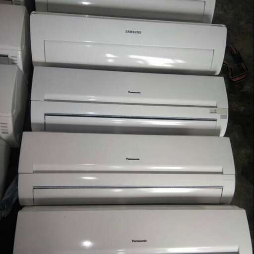 a row of white toilets sitting next to each other.
