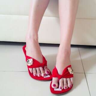 i love the red shoes with the white flowers.