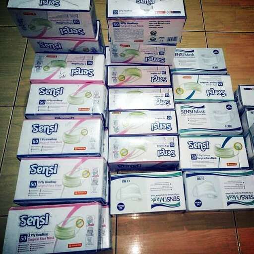 a pile of toiletries sitting on top of a tiled floor.