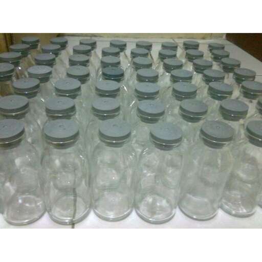 a group of empty glass jars sitting on top of a table.