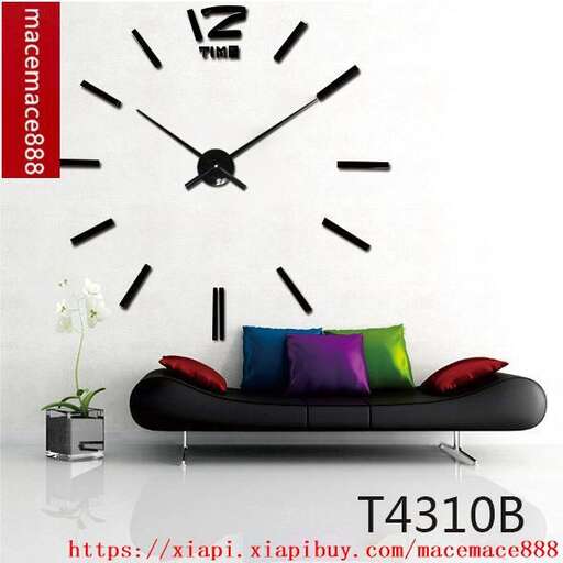 a black couch with a clock on the wall and a flower in the center.