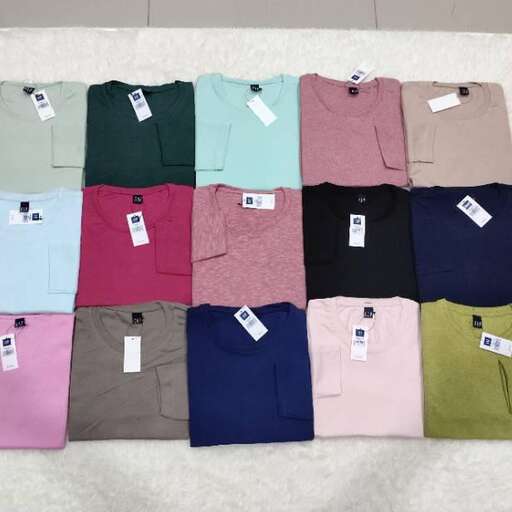 a selection of folded shirts