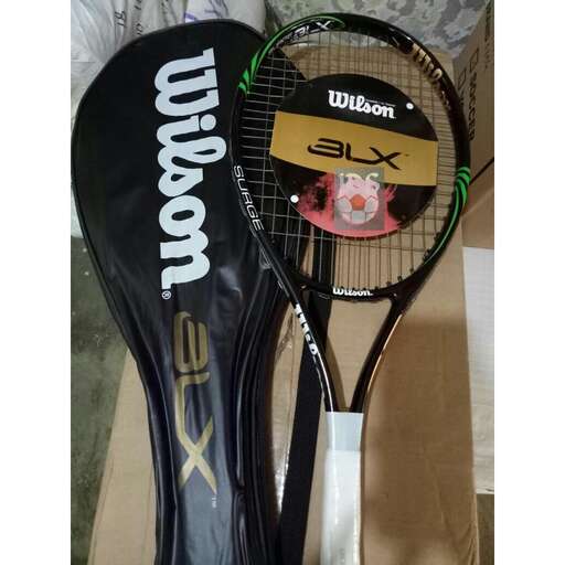 a tennis racket with a tennis ball on it
