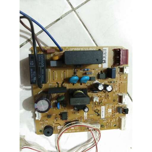 a picture of a motherboard with some wires attached.