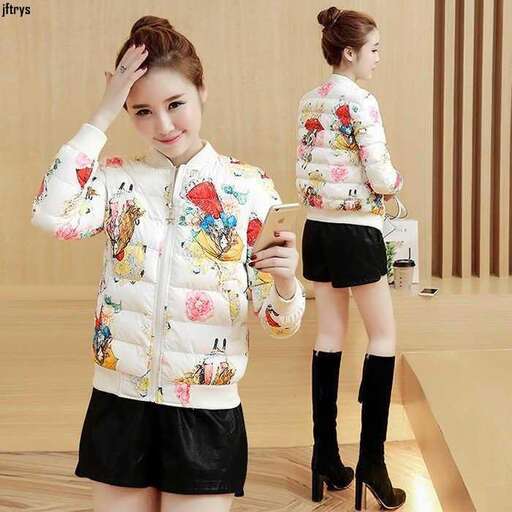 a girl in a white jacket and black shorts