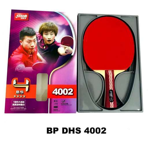 a close up of a ping pong paddle and a plastic ball