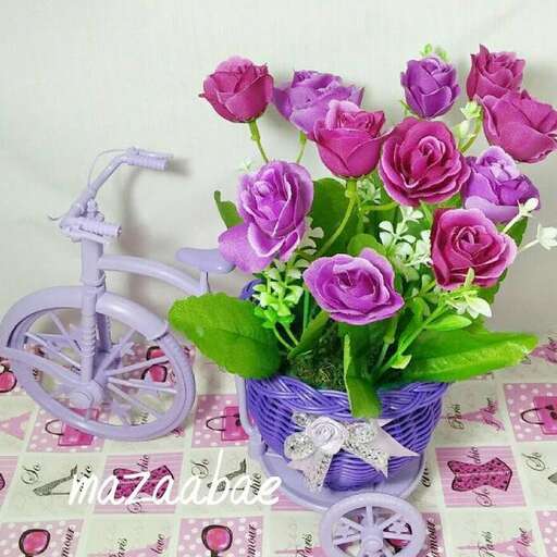 a purple bicycle with a purple bike in a basket.