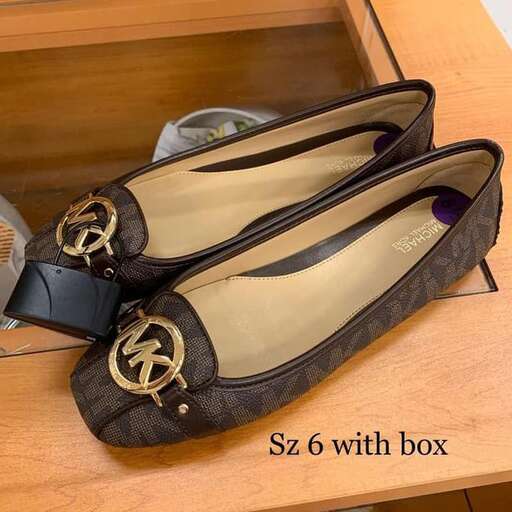 a pair of shoes with a shoe on the side.