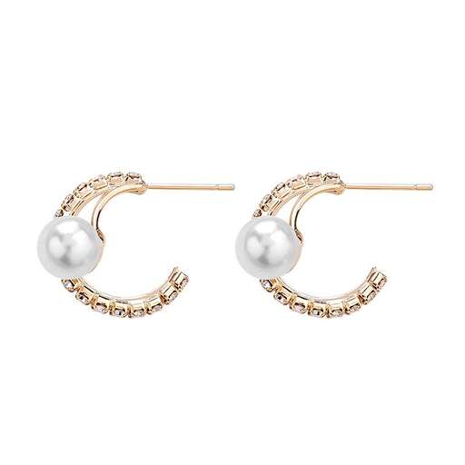 a pair of pearl and diamond earrings