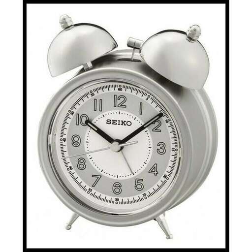 a clock that is on a white background.