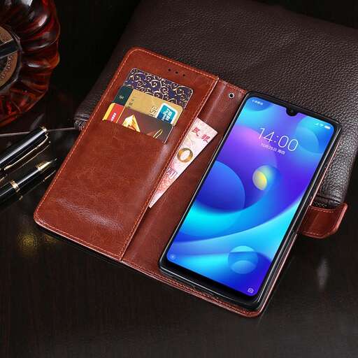 a leather wallet with a cell phone on it.