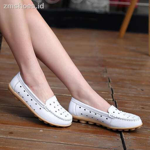 a woman's legs in a pair of shoes.