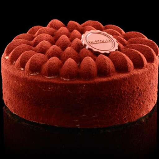 a chocolate cake with a chocolate sticker on top.