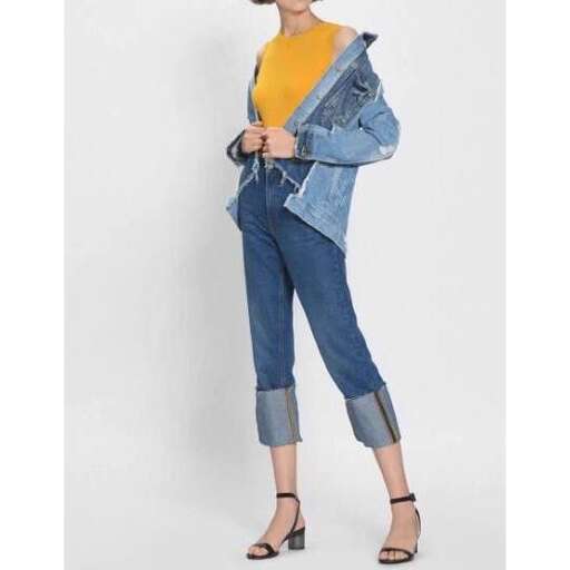 a model wears a denim jacket with a denim jacket and a denim jacket.