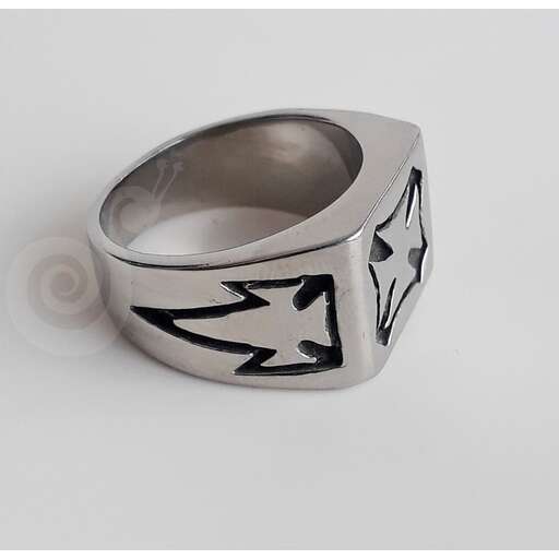 a ring made from a handmade sterling silver with a black and white design.