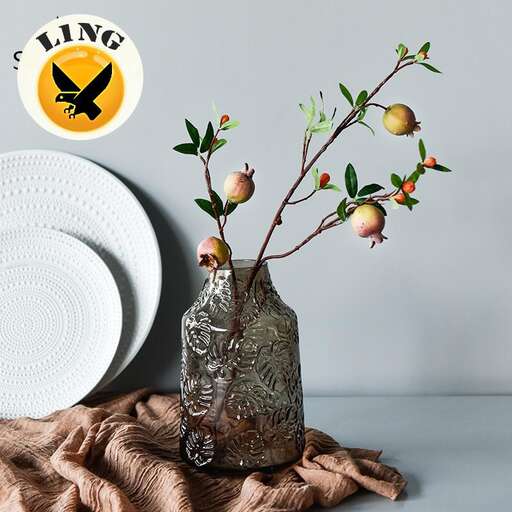 a vase with fruit on top of it