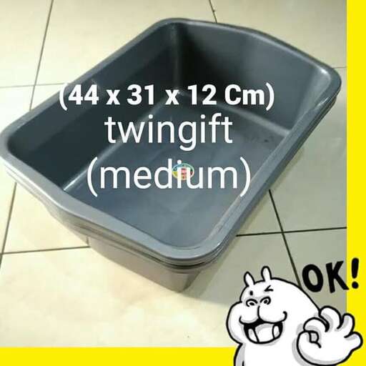 this is a picture of a cat in a litter box.