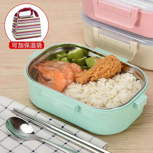 a lunch box with rice, rice, and vegetables.