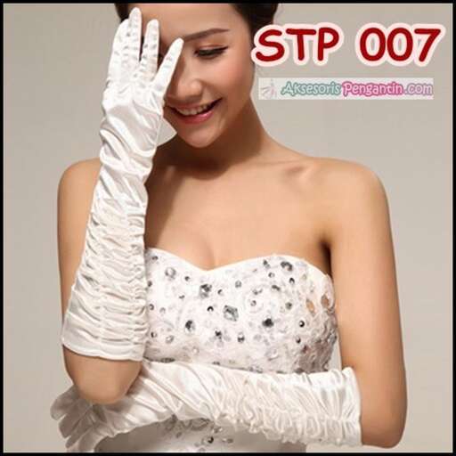 a woman with a bandaged hand and gloves on her head