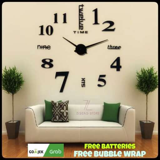 a wall clock with a green pillow and a pillow.