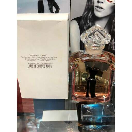 perfumes are displayed in a case at the store.