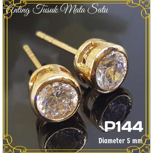 a set of gold and black earrings with gold accents.