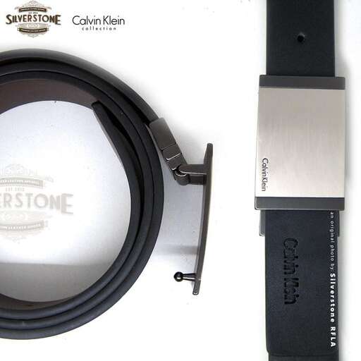 a knife and a case sitting on a white background.