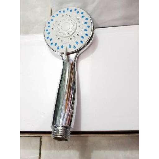 a toothbrush in a bowl on a counter.