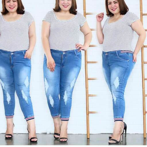 a girl in a striped t - shirt and jeans