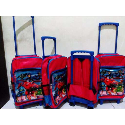 two bags of luggage are sitting on the floor.