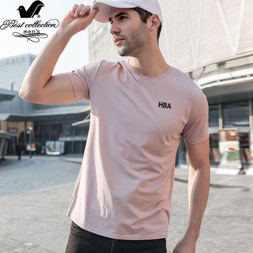 a man in a pink shirt and black shorts