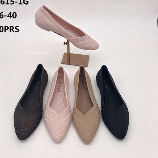 a pair of shoes with a wooden stand.