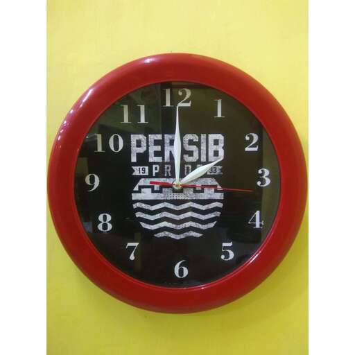 a clock with a red face and a white clock.