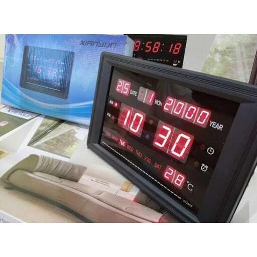 a digital clock with red numbers on it.