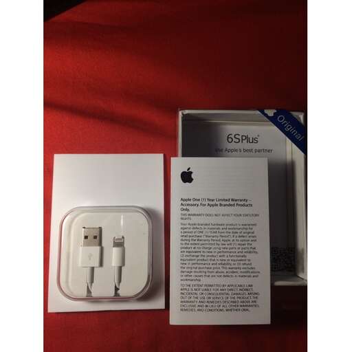 a box with a white cord and a white phone