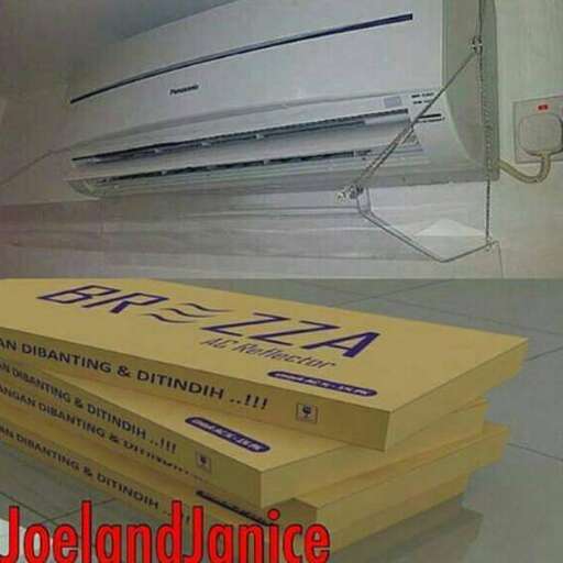 a stack of yellow books sitting on top of a white floor.