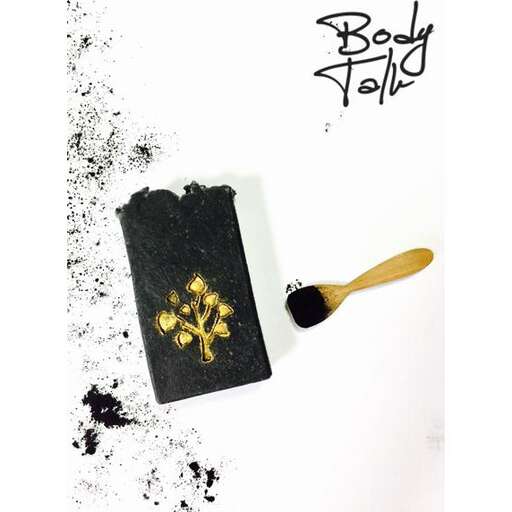 a book and a spoon in a white background.