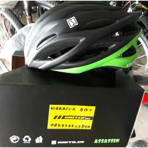 a helmet is on a box in a garage.
