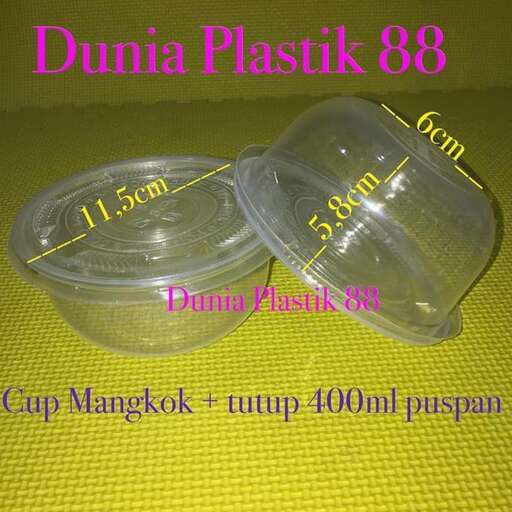 a plastic container with a lid and a measuring cup.