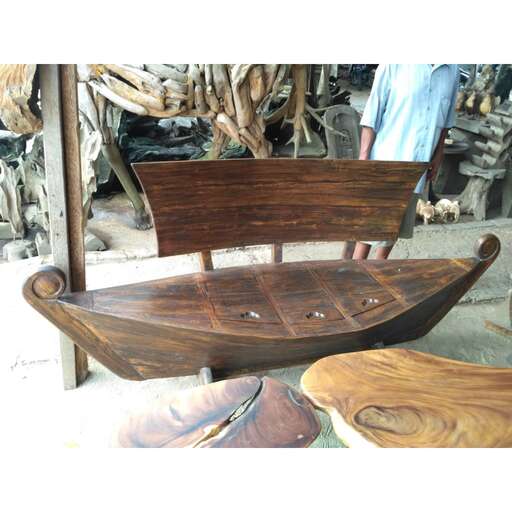 a wooden chair sitting on top of a wooden table.