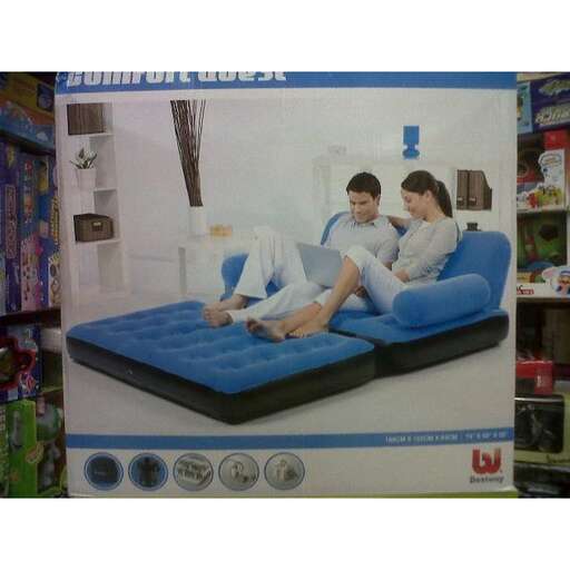 a picture of a man and a woman on a bed.