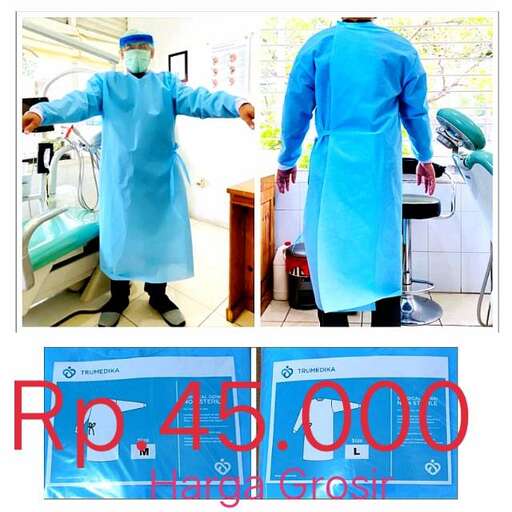 a man in a blue uniform standing next to a machine.