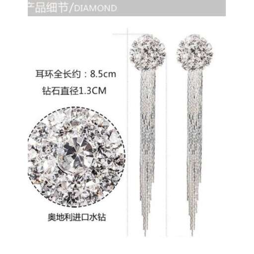 a pair of earrings with a diamond