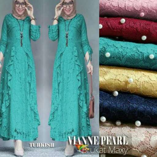 a long sleeved green dress with gold embroidery