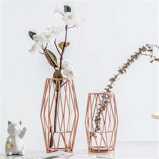 a pair of vases with flowers in them.