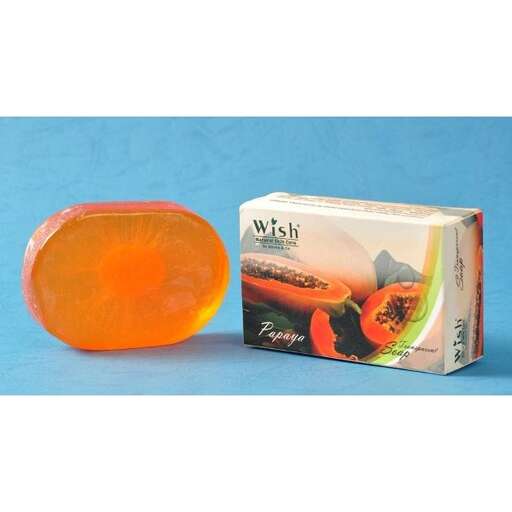 a small orange glass bottle with a single orange inside.